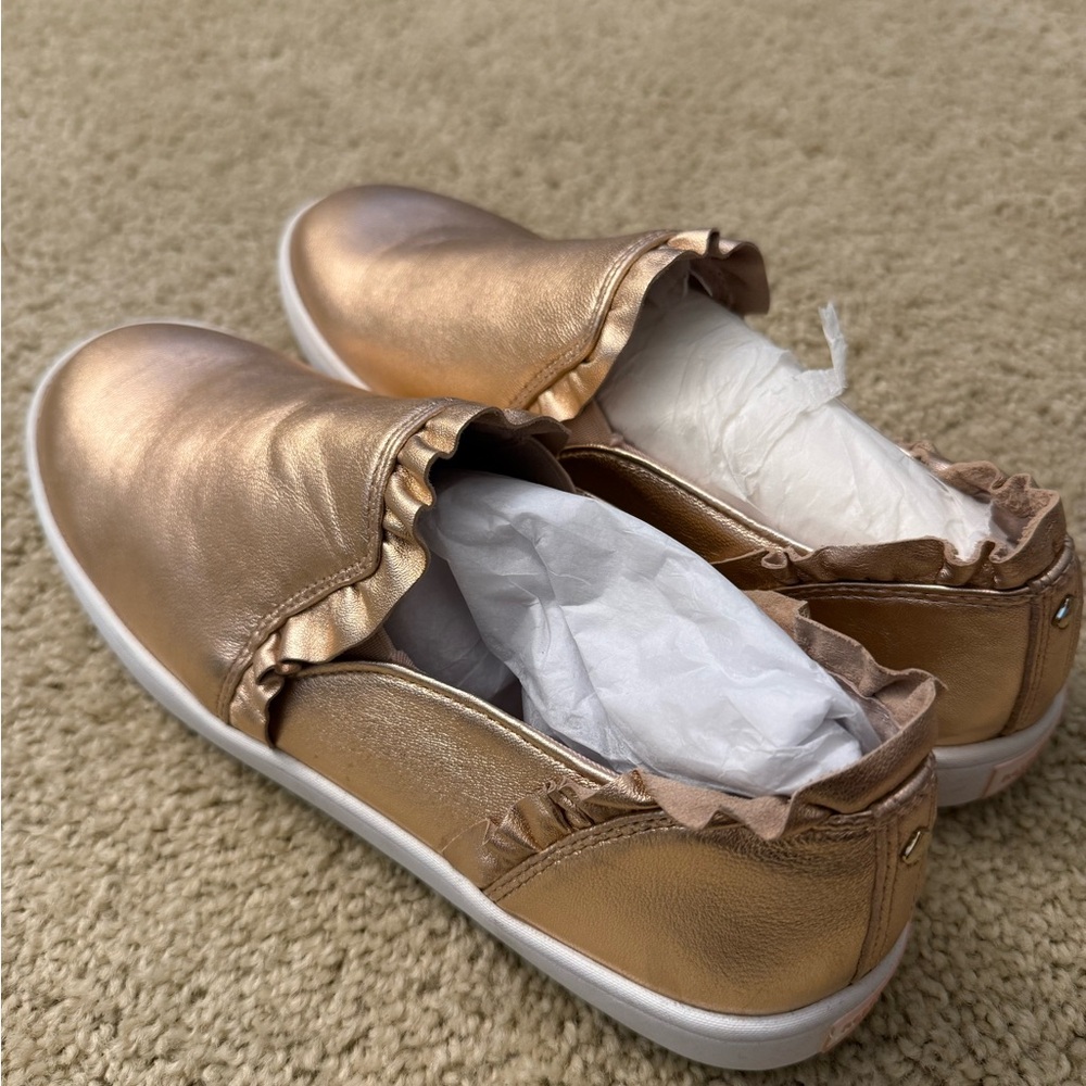 NEVER WORN Kate Spade rose gold slip ons with ruffle detail. Size 10